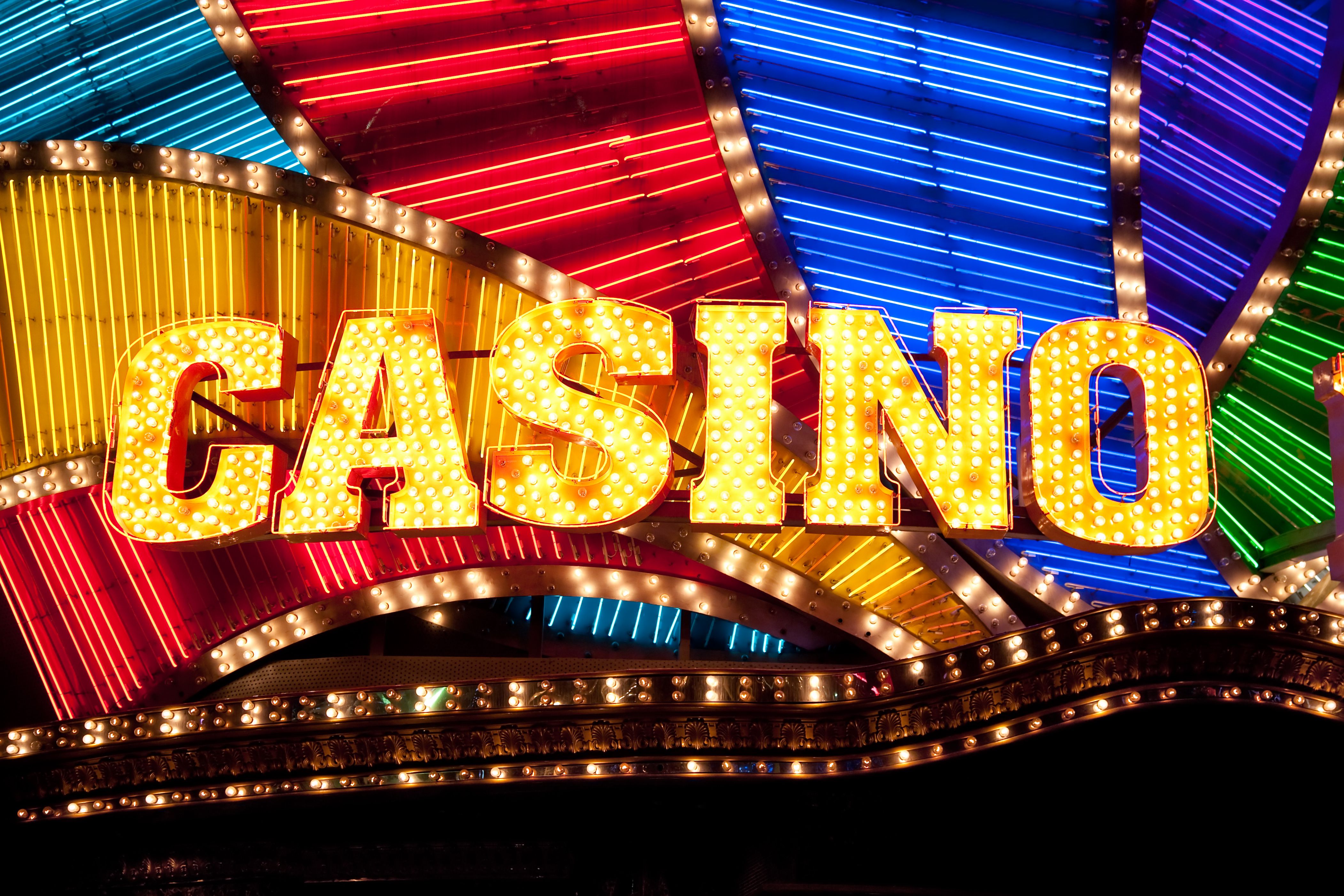 A vibrant graphic showcasing the Gold Fish Casino logo with a cascade of gold coins and bubbles.